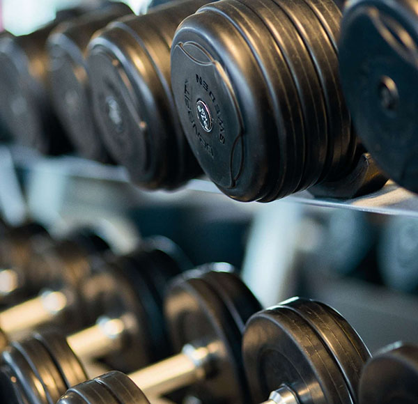 bodybuilding-close-up-dumbbells-equipment-260352